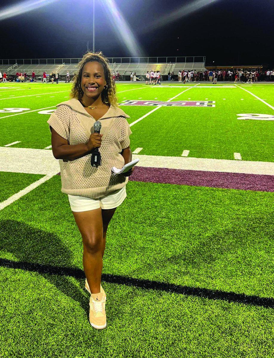 Ashtyn Henderson covers a high school football game on the sidelines.She also covers behind the scenes at practice.