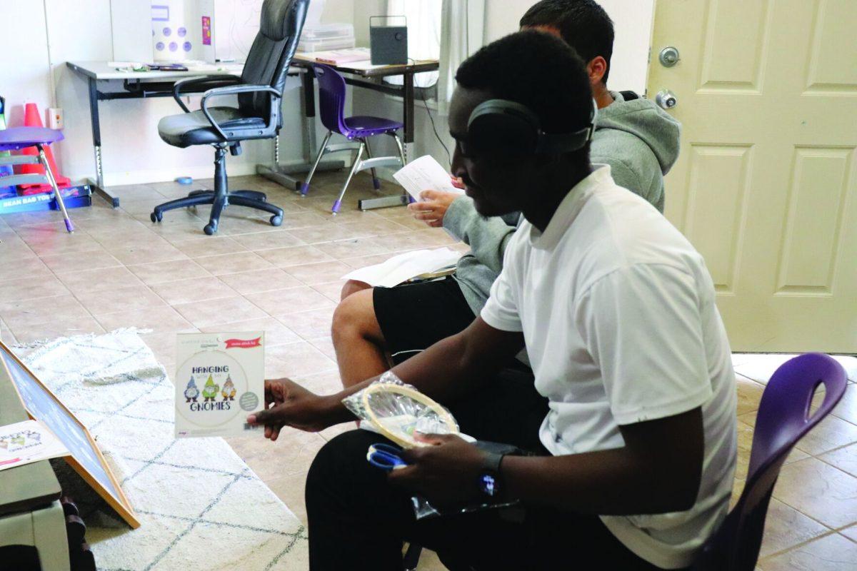 Samuel N’Guessan crafts with an embroidery circle.