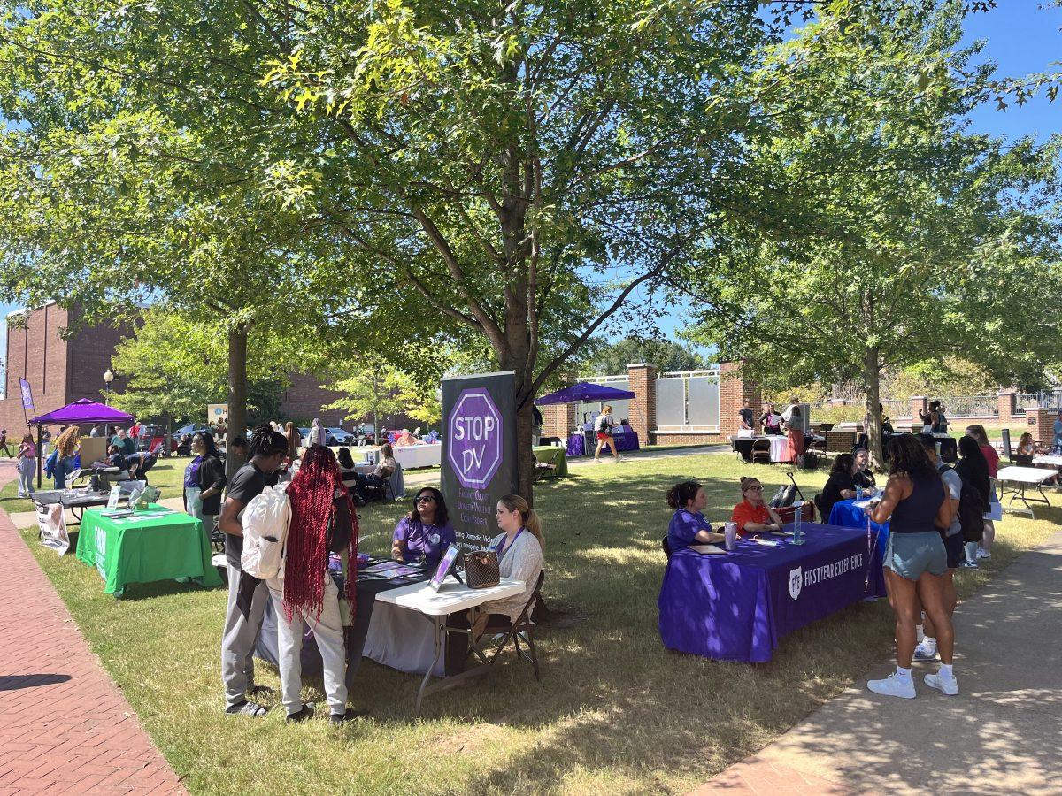 Several volunteer organizations talk to passersby about service opportunities in front of the student center Sept. 9. Tables included student-led groups such as the Green Bear Coalition, as well as outside groups such as the Arkansas Blood Institute. 