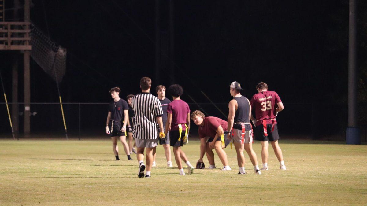 Pi Kappa Alpha and Sigma Tau fraternity members set up the ball during the final match of the tournament. Pi Kappa Alpha won 14-0. 