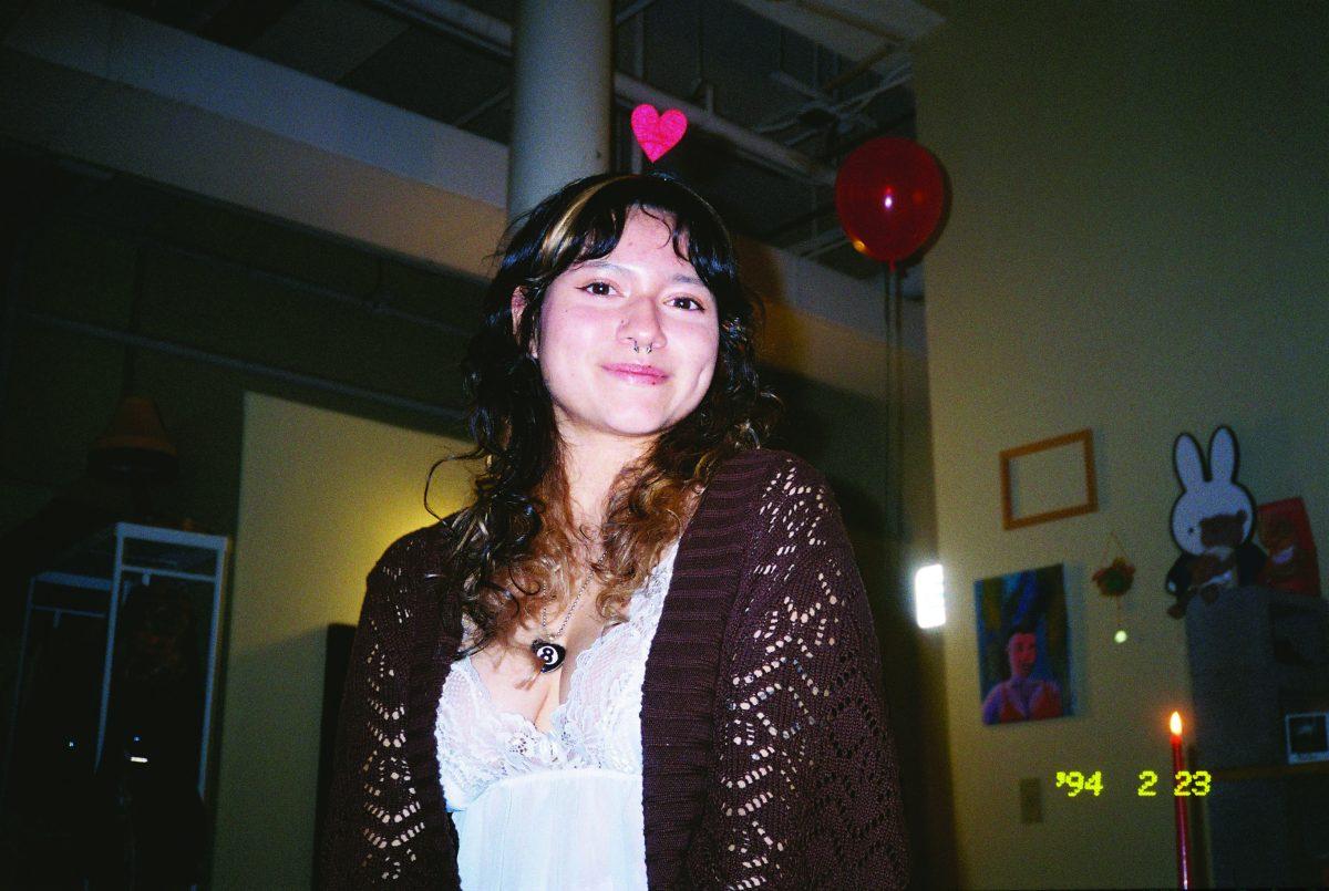 Tattoo artist, Didi Vasquez, seen posing for a photo. Vasquez expressed her feeling towards tattooing by saying, "It's definitely an intimate form of work."