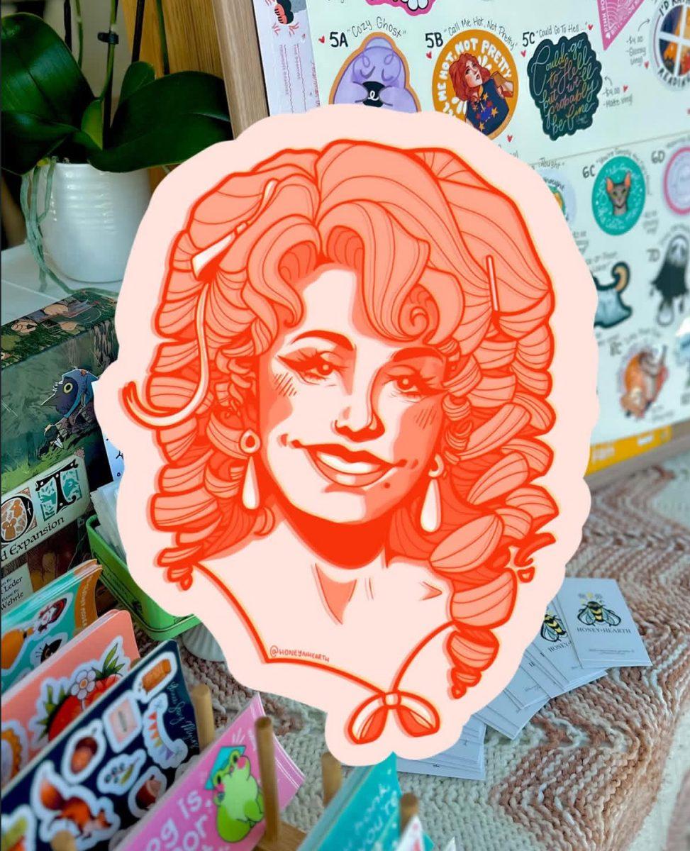 Anna Sting-Myers has crafted numerous stickers each with a unique design. Above is showcasing a Dolly Parton inspired sticker. (photo courtesy of @honeyhearth on instagram)