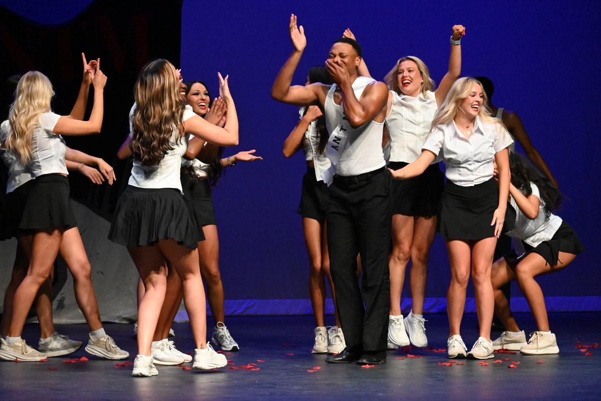 Senior psychology major Demetrius Foreman performs in the talent round in an act inspired by "America's Next Top Model." Foreman was awarded the title of Greek God at the end of the competition.