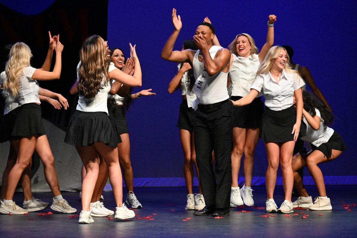 Senior psychology major Demetrius Foreman performs in the talent round in an act inspired by "America's Next Top Model." Foreman was awarded the title of Greek God at the end of the competition.