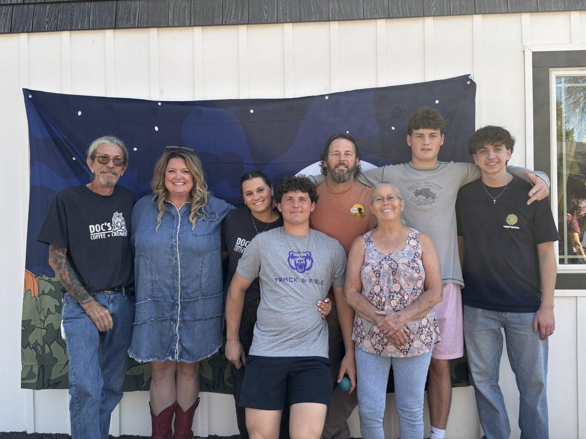 Owners of Picklesgap Village. Bill and Kathy Brown, pose with their family who help with the in and outs of the Village. Second to the left (Kathy brown), third to the left (Emmy Brown), fourth to the left (Bill Brown.)(photo by Harper Phillips)