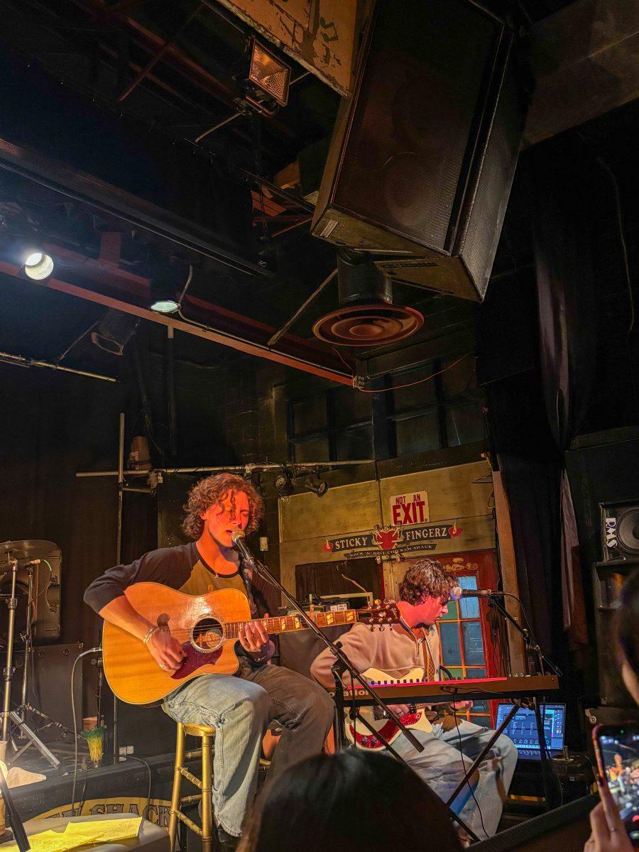 Jake Minch and one of his bandmates, Michael Andrew, sing a tune together. The night's performance consisted mostly of Minch's recent album "George."(photo by Harper Phillips)