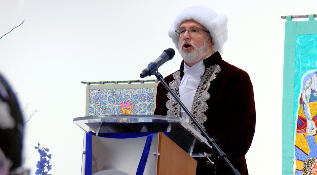 UCA President Houston Davis speaks at "Gathering at 250" Feb. 12. At the event, held in the Baum Gallery, several student artists' works were displayed. 