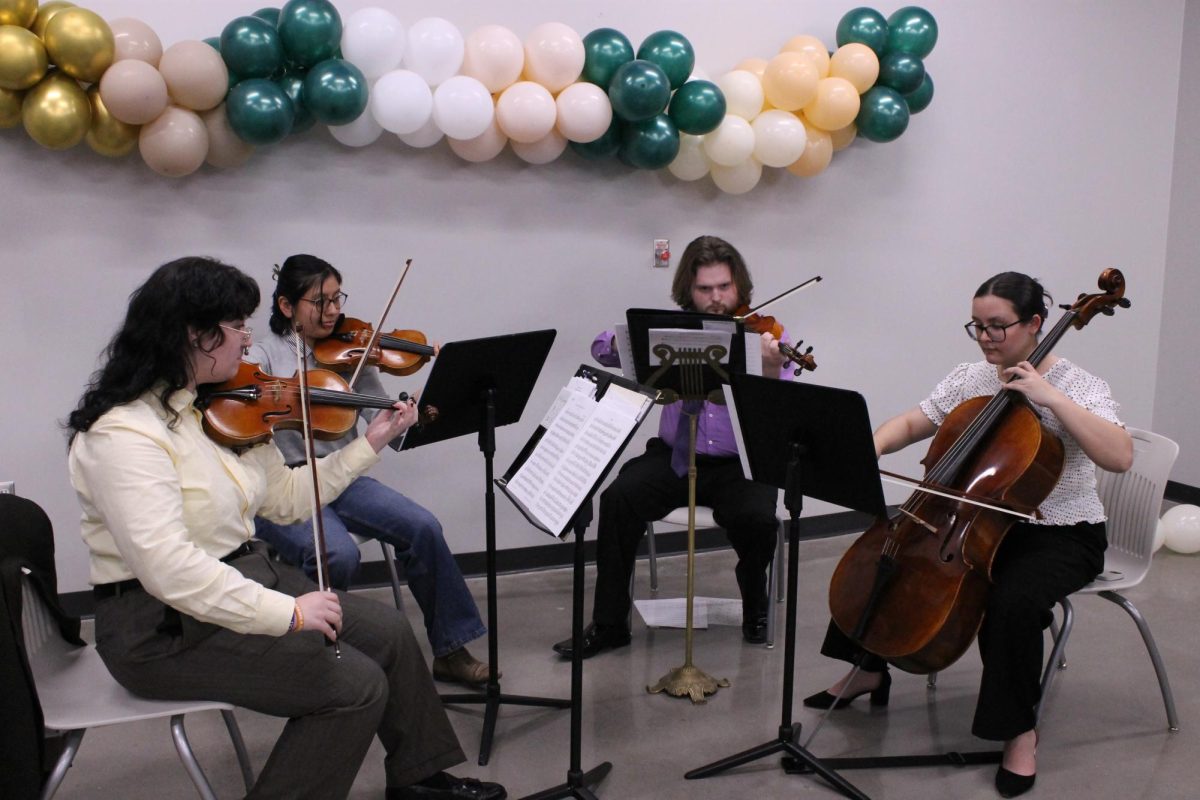 A group of students plays a string melody at NRHH's "An Evening in the Garden" March 13. The event was meant to honor Women's History Month. 